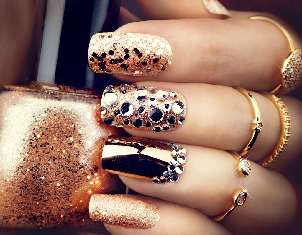 Jewelry trends include rose gold and yellow gold rings to match nail design.